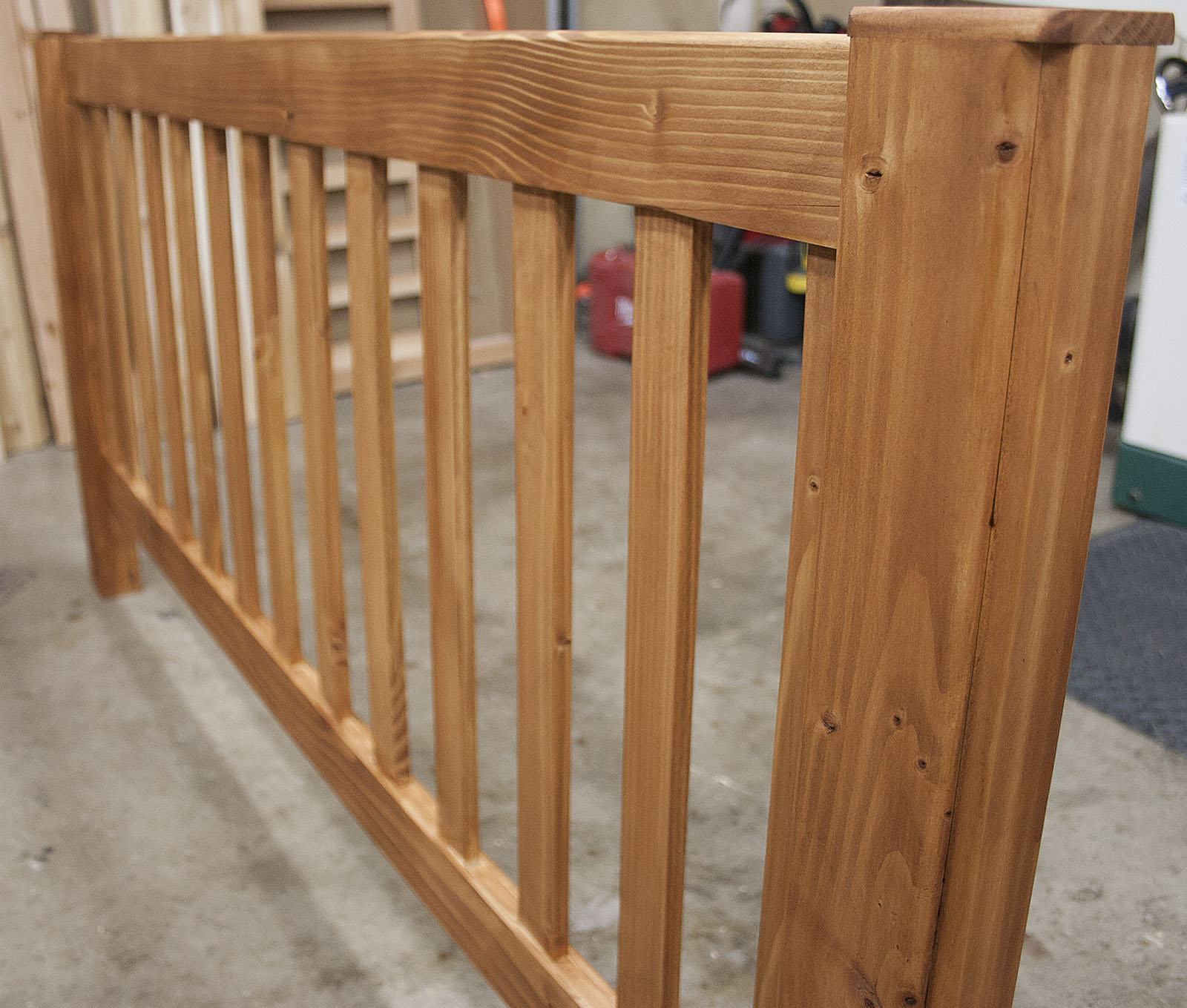 Fir vertical-slat headboard with dark shellac finish