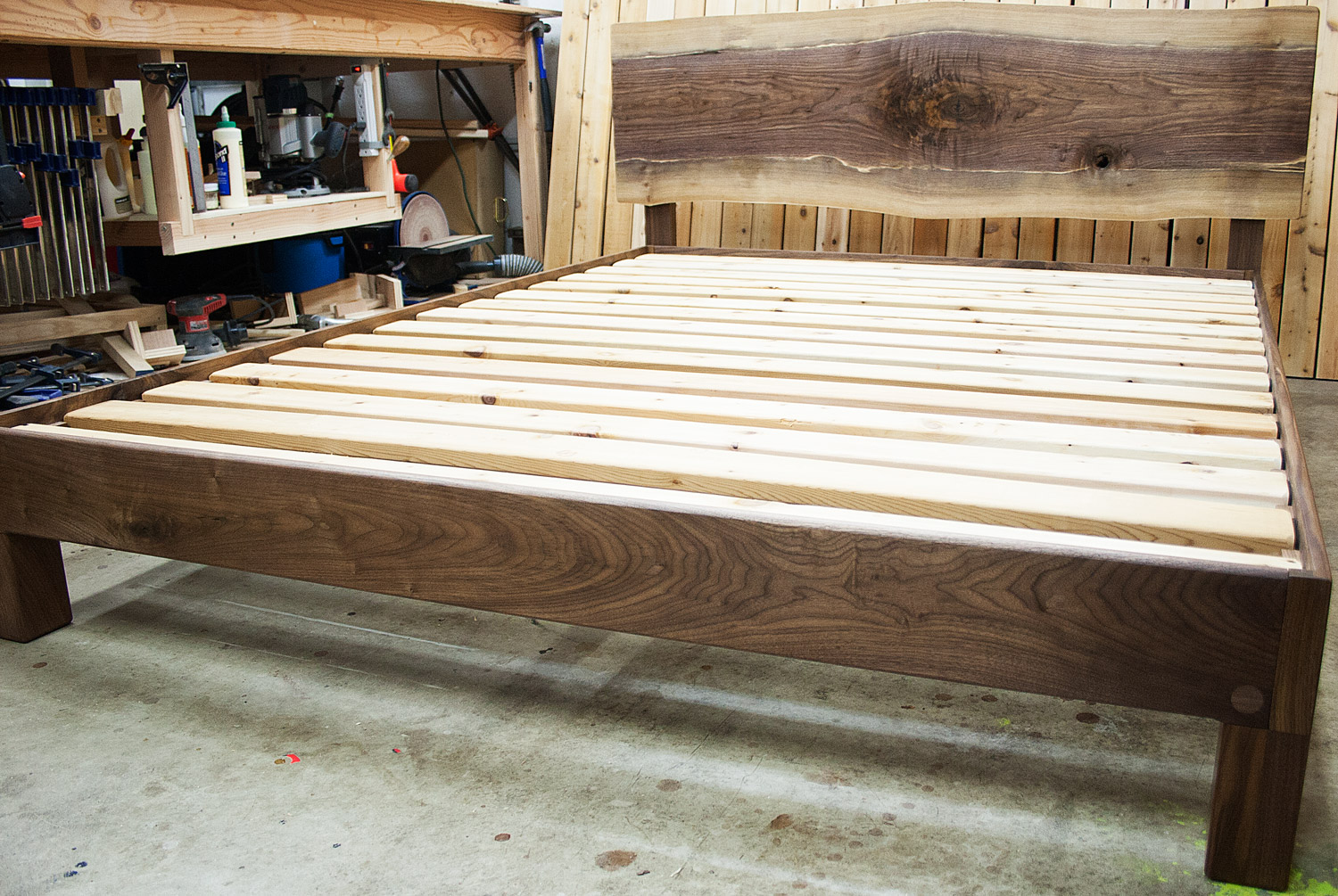 Live-edge walnut slab headboard and frame