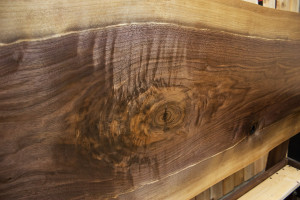 Live-edge walnut slab headboard